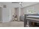 ' bedroom features neutral paint, carpet, a ceiling fan, and natural light at 2135 Vittorio Ln, Apex, NC 27502