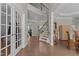 Bright, spacious foyer with hardwood floors and a staircase leading to the second level at 2135 Vittorio Ln, Apex, NC 27502