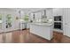 Gourmet kitchen with stainless steel appliances, granite countertops, and a central island at 2135 Vittorio Ln, Apex, NC 27502