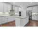 Spacious kitchen with granite countertops, stainless appliances, and convenient center island at 2135 Vittorio Ln, Apex, NC 27502