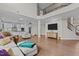 Open concept living area featuring hardwood floors and seamless flow to a modern kitchen at 2135 Vittorio Ln, Apex, NC 27502