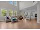 Expansive living room boasts soaring ceilings, abundant natural light, and an open floor plan at 2135 Vittorio Ln, Apex, NC 27502