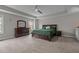 Spacious main bedroom features tray ceilings, neutral carpet, and classic dark wood furniture at 2135 Vittorio Ln, Apex, NC 27502