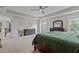 Bright and airy main bedroom with neutral carpet, with a view of walk in closet at 2135 Vittorio Ln, Apex, NC 27502