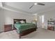 Comfortable main bedroom with a ceiling fan, and carpeted floor provides comfort at 2135 Vittorio Ln, Apex, NC 27502