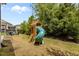 Backyard playground featuring a wood play structure with a slide and swing at 2135 Vittorio Ln, Apex, NC 27502