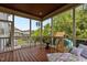 Inviting screened porch featuring wood ceiling, railings, comfortable seating, and backyard views at 2135 Vittorio Ln, Apex, NC 27502