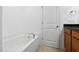 Bathroom with soaking tub with granite counters and neutral paint at 2242 Sweet Annie Way, Wake Forest, NC 27587