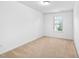Carpeted bedroom with light, neutral walls and one window at 2242 Sweet Annie Way, Wake Forest, NC 27587