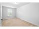 Bedroom with carpet, window, and neutral paint color at 2242 Sweet Annie Way, Wake Forest, NC 27587