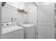 Laundry room with washer and dryer and wire shelving for storage at 2242 Sweet Annie Way, Wake Forest, NC 27587