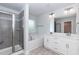Modern bathroom with double vanity, soaking tub, walk-in shower with gray tile, and neutral floors at 279 Hopewell Branch Ct, Smithfield, NC 27577