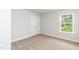 Bedroom featuring carpet, a window for natural light, and a double door closet at 279 Hopewell Branch Ct, Smithfield, NC 27577
