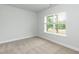 Well lit bedroom with a window overlooking a green space at 279 Hopewell Branch Ct, Smithfield, NC 27577
