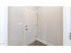 White interior door with bronze hardware and a neutral color palette with vinyl flooring at 279 Hopewell Branch Ct, Smithfield, NC 27577