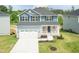 New two-story home with blue siding, gray roof, and a two-car garage at 279 Hopewell Branch Ct, Smithfield, NC 27577
