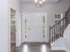 Foyer with hardwood floors, white front door, and staircase at 279 Hopewell Branch Ct, Smithfield, NC 27577
