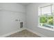 Laundry room with vinyl floors and hookups for washer and dryer at 279 Hopewell Branch Ct, Smithfield, NC 27577