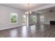 This brightly-lit living room has a fireplace and access to a deck at 279 Hopewell Branch Ct, Smithfield, NC 27577