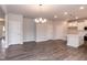 An open-concept kitchen and living room boasts hard surface floors at 279 Hopewell Branch Ct, Smithfield, NC 27577