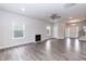 Spacious living room with hardwood floors, ceiling fan, and a fireplace at 279 Hopewell Branch Ct, Smithfield, NC 27577