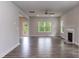 Spacious living room with hardwood floors, ceiling fan, and a fireplace at 279 Hopewell Branch Ct, Smithfield, NC 27577