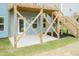 Outdoor patio beneath the deck, featuring supporting beams and access to the backyard and upper deck at 279 Hopewell Branch Ct, Smithfield, NC 27577