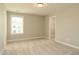 Spacious bedroom with neutral carpet, light walls, walk-in closet and window at 3002 Dog Rose Dr # 310, Durham, NC 27703