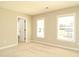 Bright bedroom with neutral walls, plush carpet, and two windows offering lots of natural light at 3002 Dog Rose Dr # 310, Durham, NC 27703