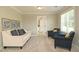 Neutral living room featuring stylish decor, plush seating, and natural light from a window at 3002 Dog Rose Dr # 310, Durham, NC 27703