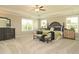 Spacious bedroom with neutral tones, large windows, ceiling fan, and furnishings at 3002 Dog Rose Dr # 310, Durham, NC 27703