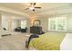 Bright and airy main bedroom with plush carpet, tray ceiling, and sitting area at 3002 Dog Rose Dr # 310, Durham, NC 27703