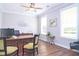 A well-lit office features wood floors, a ceiling fan, and natural light from two windows at 3002 Dog Rose Dr # 310, Durham, NC 27703