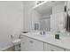 Well-lit bathroom with white cabinetry, a large mirror and white ceramic sink basin at 3015 Winston Dr # 117, Burlington, NC 27215