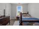 Bright bedroom with wood-look floors and natural light at 3015 Winston Dr # 117, Burlington, NC 27215