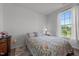 Bright bedroom featuring wood-look floors and view at 3015 Winston Dr # 117, Burlington, NC 27215