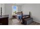 Cozy bedroom with wood-look flooring, natural light, and a comfy bed at 3015 Winston Dr # 117, Burlington, NC 27215