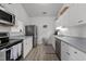Functional kitchen with stainless steel appliances, light-colored countertops, and plentiful storage at 3015 Winston Dr # 117, Burlington, NC 27215