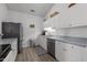 Well-lit kitchen featuring stainless steel appliances, neutral-colored countertops, and ample cabinet space at 3015 Winston Dr # 117, Burlington, NC 27215