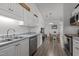 Charming kitchen with stainless steel appliances and open dining area at 3015 Winston Dr # 117, Burlington, NC 27215