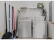 Convenient laundry room with washer, dryer, and storage shelves at 3015 Winston Dr # 117, Burlington, NC 27215