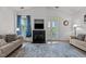 Inviting living room with a fireplace, french doors, and neutral-toned furniture at 3015 Winston Dr # 117, Burlington, NC 27215