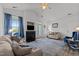 Cozy living room featuring a fireplace, large windows, and comfortable seating at 3015 Winston Dr # 117, Burlington, NC 27215