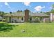 Spacious backyard with a well-maintained lawn and mature trees, perfect for outdoor activities at 305 Reynolds N Ave, Durham, NC 27707