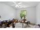 Cozy bedroom featuring a ceiling fan and a bright window with natural light at 305 Reynolds N Ave, Durham, NC 27707