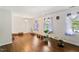 Spacious living room with hardwood floors, large windows, and neutral walls creating a serene atmosphere at 305 Reynolds N Ave, Durham, NC 27707