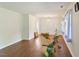 Bright living room with wood floors, white walls, and natural light from window at 305 Reynolds N Ave, Durham, NC 27707