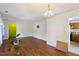 Bright living space with hardwood floors, a decorative chandelier, and access to the kitchen at 305 Reynolds N Ave, Durham, NC 27707