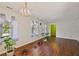 Bright and spacious living area with hardwood floors, ample natural light, and modern light fixture at 305 Reynolds N Ave, Durham, NC 27707
