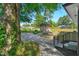 Backyard view featuring a storage shed and lush greenery, accessed by stairs at 308 Lynn Road, Durham, NC 27703